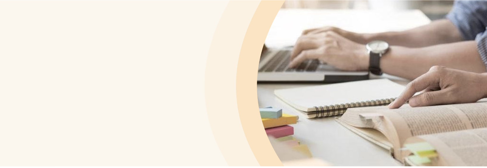 Researchers working with books and a laptop